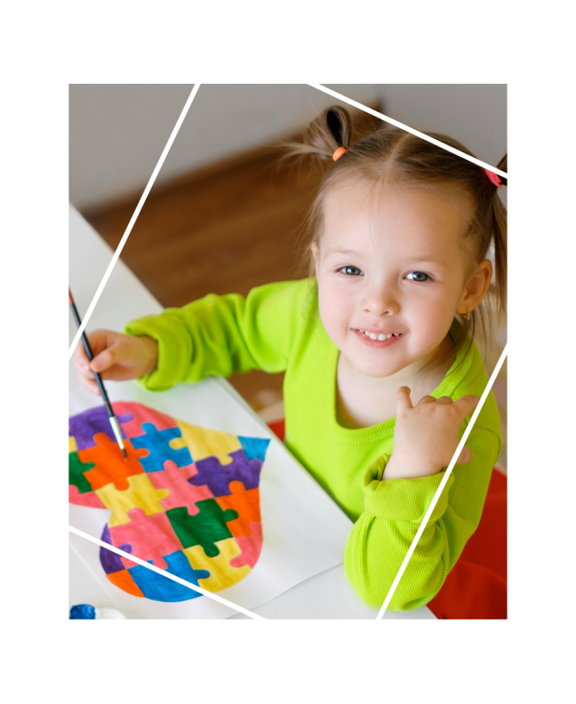 Little girl painting a heart craft