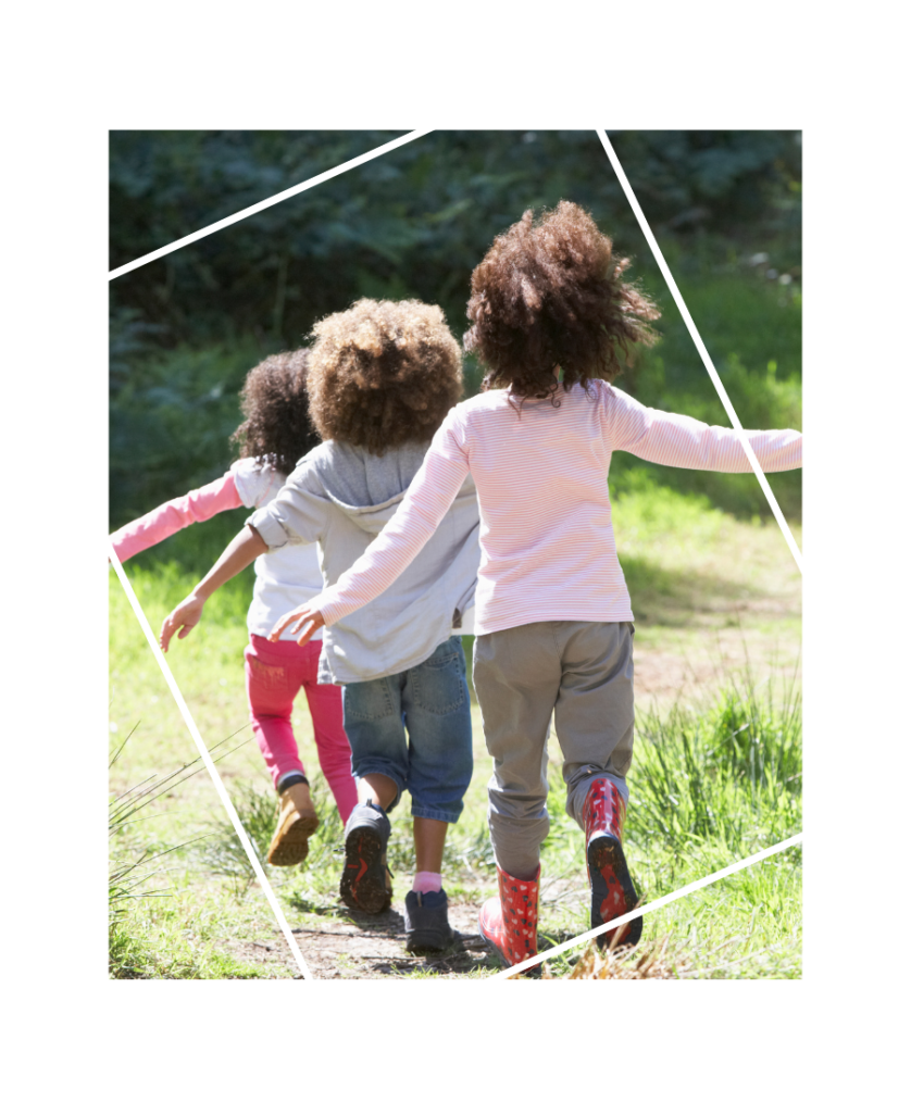 Three children running and playing outside